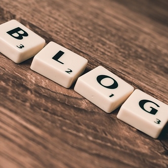 Scrabble letters spelling "blog"